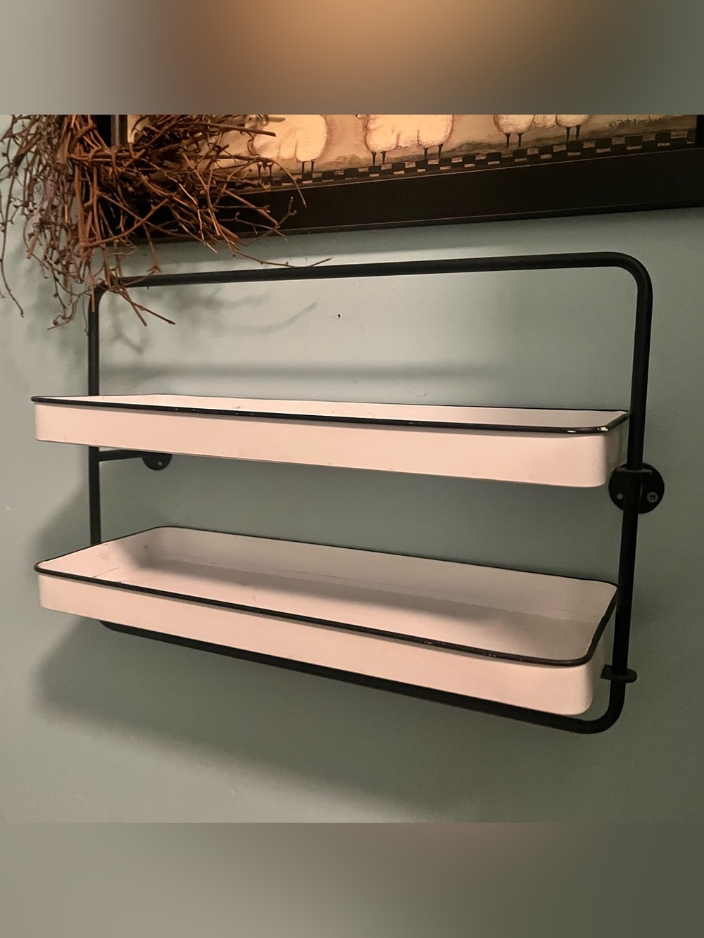 Black Metal Two-Tier Wall Shelf with White enamel Trays shelves .